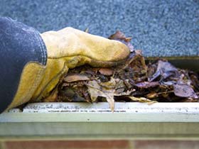 one of our contractors is cleaning a rain gutter