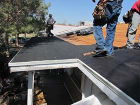 three of our Sacramento roofers working on installing a new roof